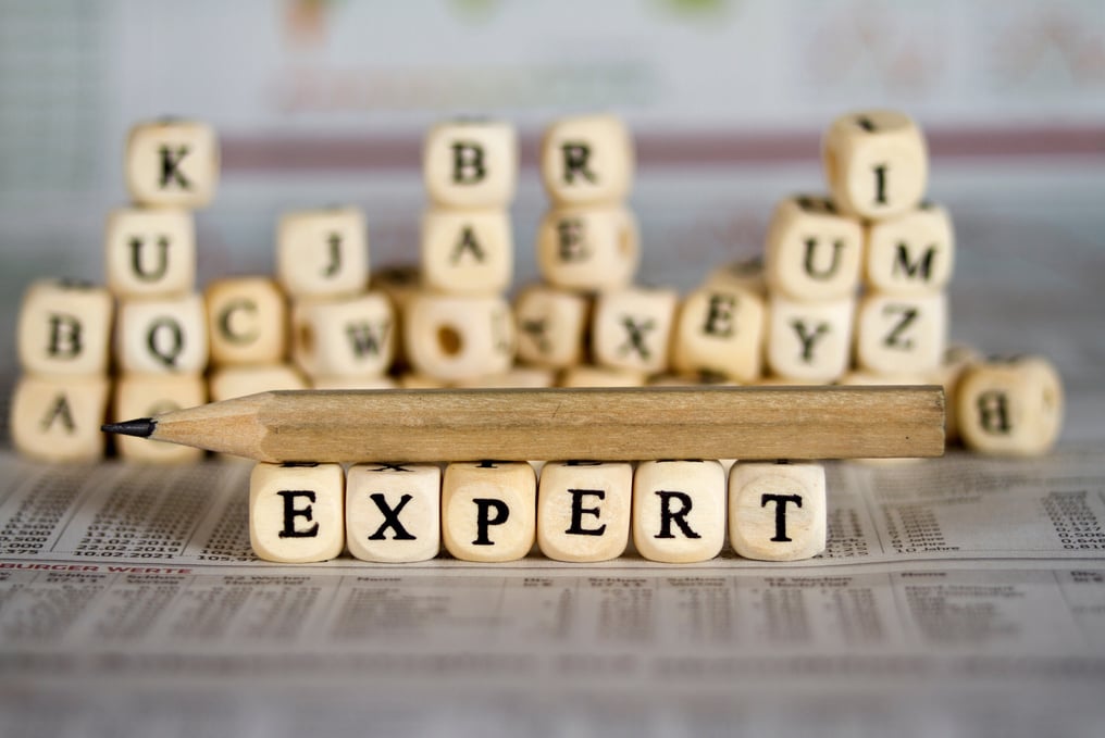 expert word on newspaper background